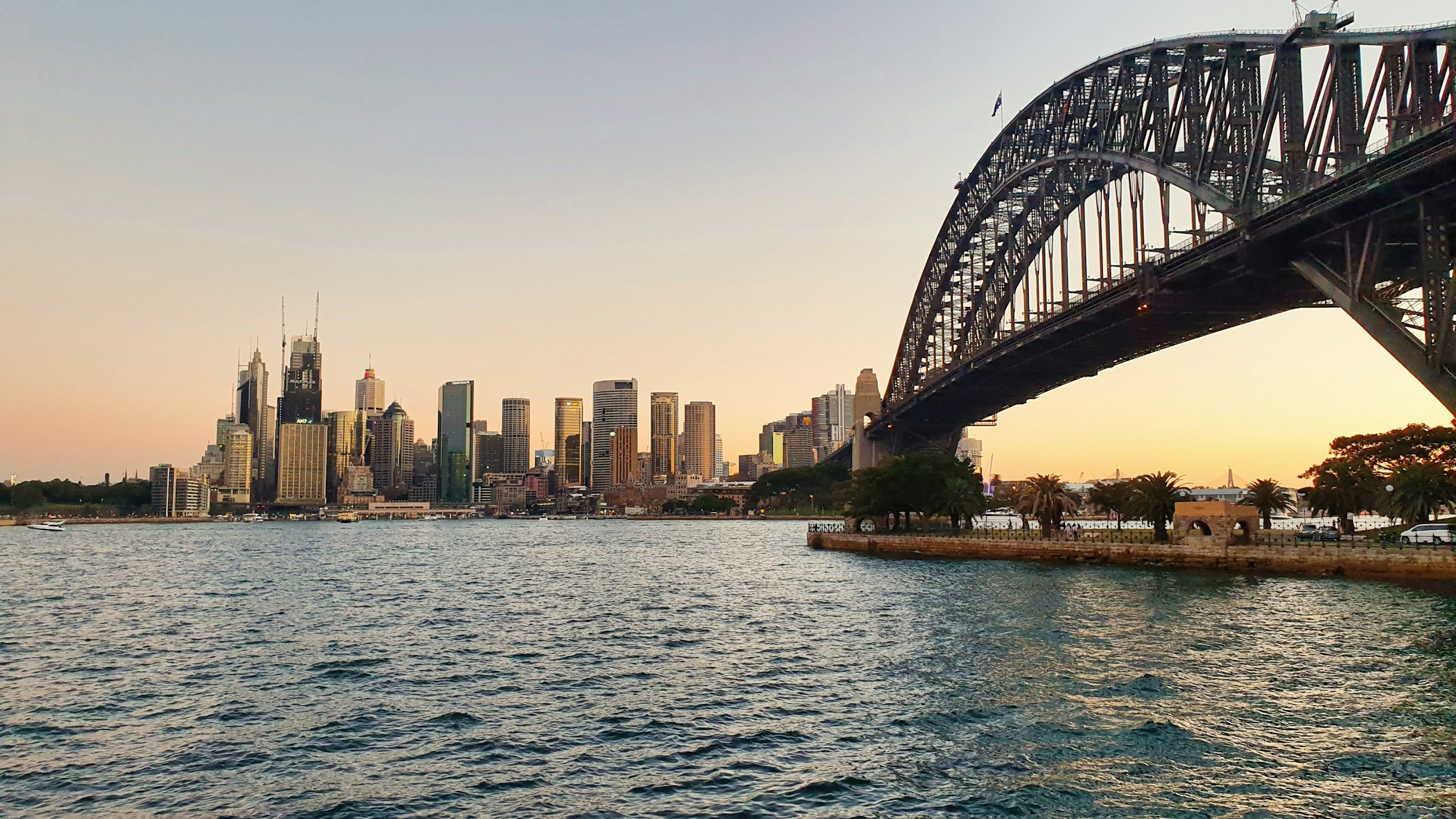 Sydney CBD skyline and Harbour Bridge at sunset